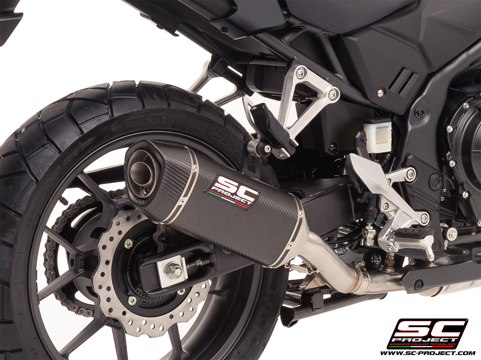 Honda NX500 with SC-Project SC1-S carbon exhaust, 3/4 rear view
