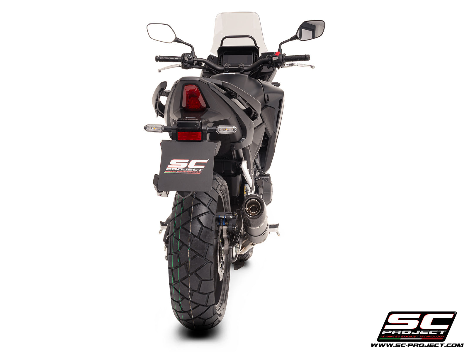 Honda NX500 with SC-Project Ovaal carbon exhaust, 3/4 rear view