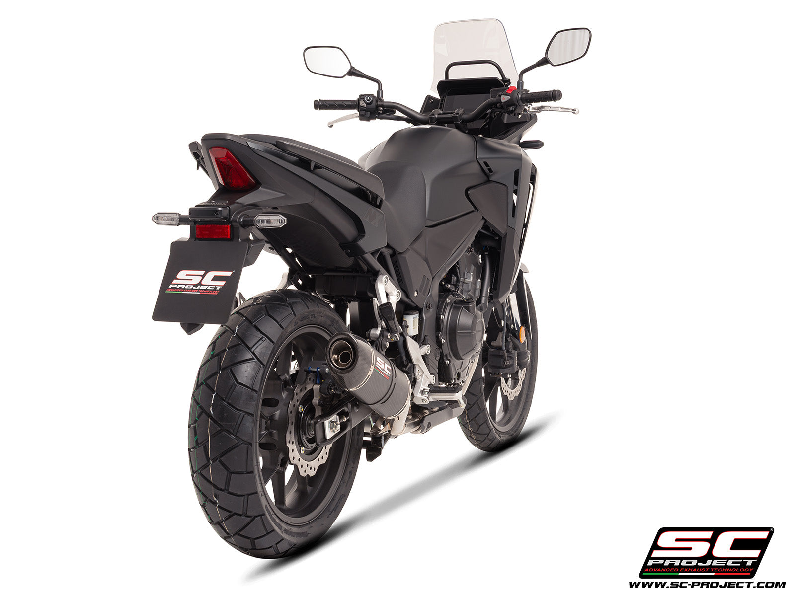 Honda NX500 with SC-Project Ovaal carbon exhaust, 3/4 rear view