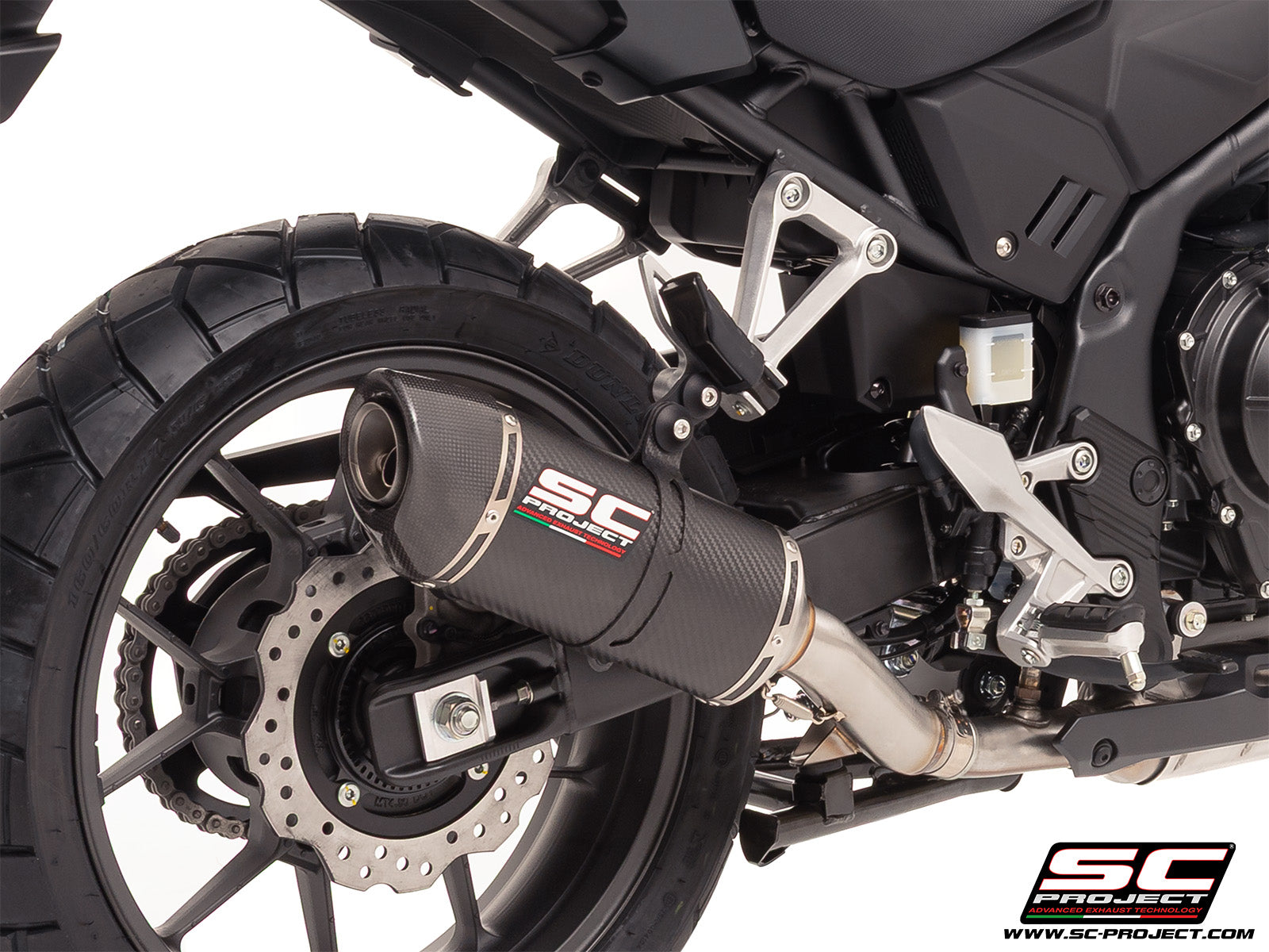 Honda NX500 with SC-Project Ovaal carbon exhaust, 3/4 rear view