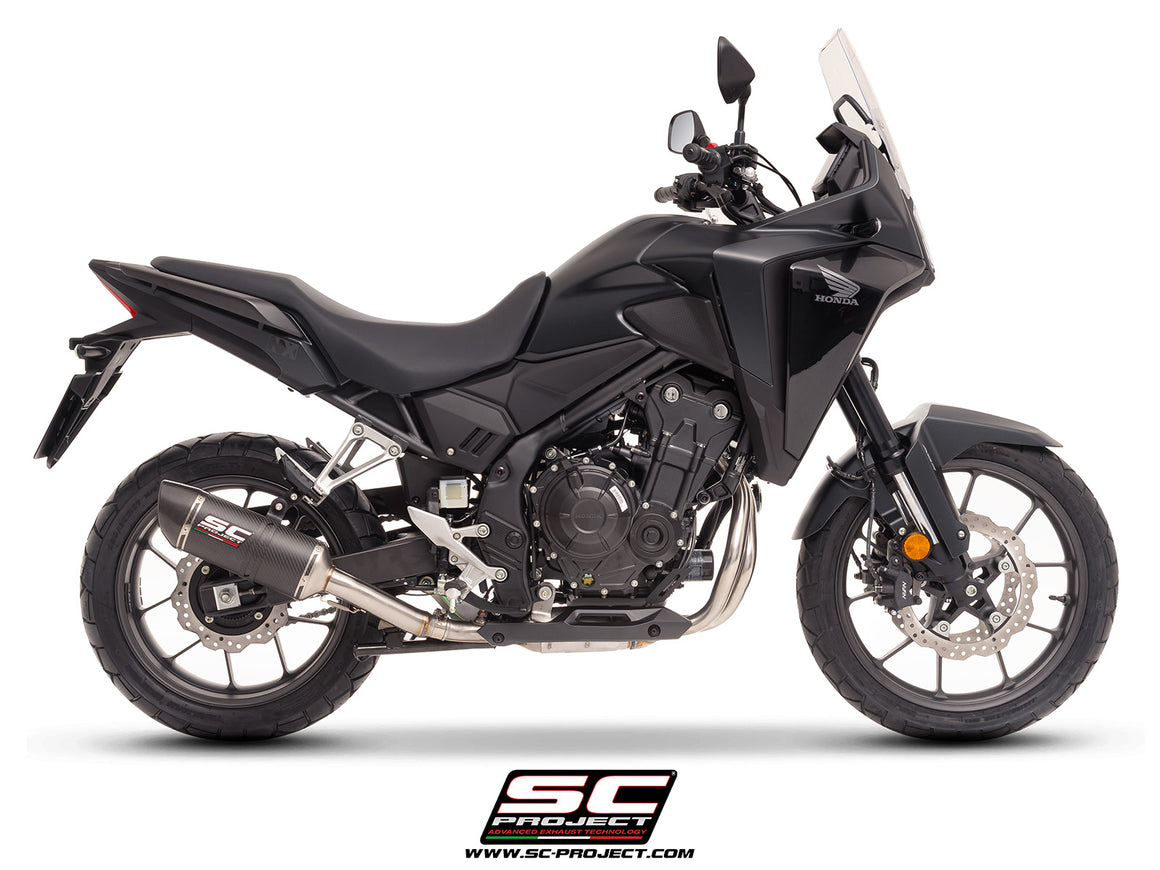Honda NX500 with SC-Project Ovaal carbon exhaust, 3/4 rear view