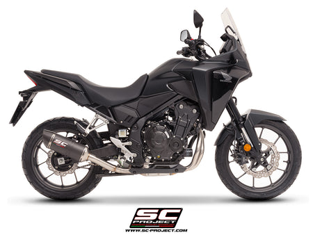 Honda NX500 with SC-Project Ovaal carbon exhaust, 3/4 rear view